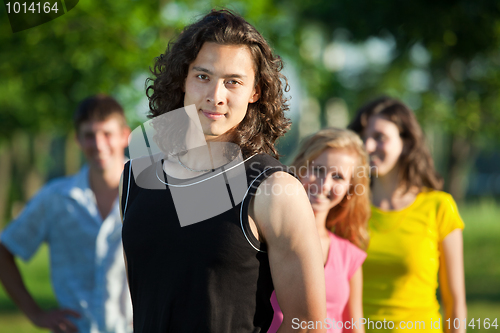 Image of Korean youth against the background of his friends