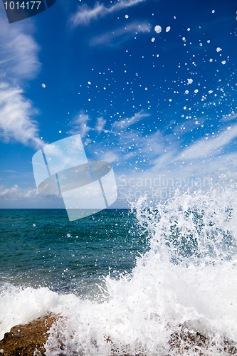 Image of The waves breaking on a stony beach