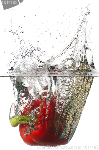 Image of Red pepper falling in a water