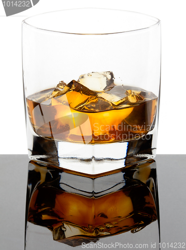 Image of Glass of whiskey with ice cubes