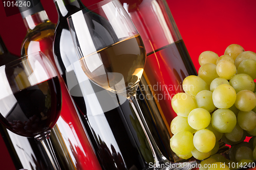 Image of Bottles, glasses and grapes