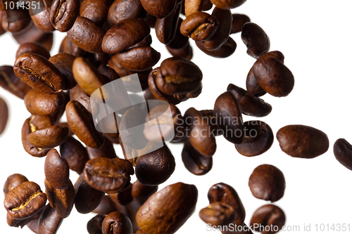 Image of Falling coffee beans on white background