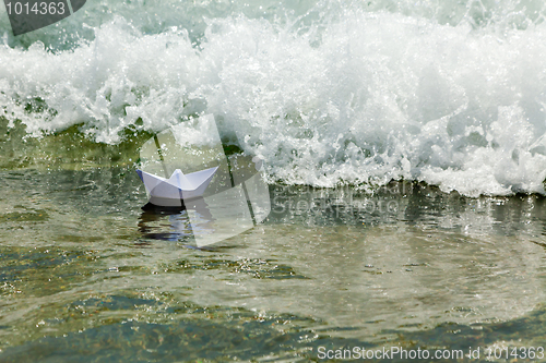 Image of Paper boat now die in a huge wave