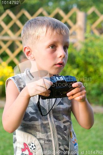 Image of The boy with the camera.