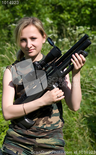 Image of The girl with an air rifle.