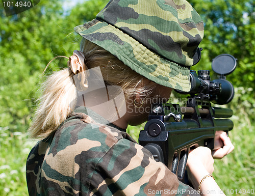 Image of The girl with a rifle.
