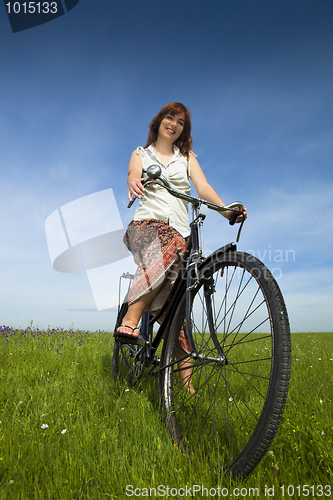 Image of Girl with a bicycle