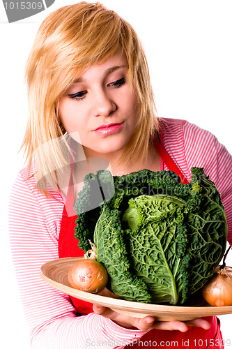 Image of beautiful woman with fresh savoy cabbage and onions