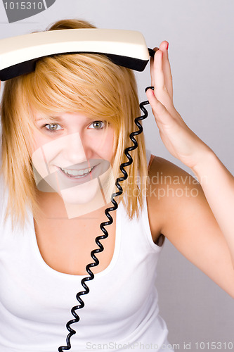 Image of blond woman with retro telephone