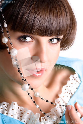 Image of brunet woman with pearl beads