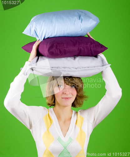 Image of woman with pillows stack