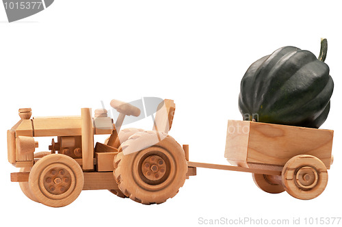 Image of Toy tractor with green pumpkin.