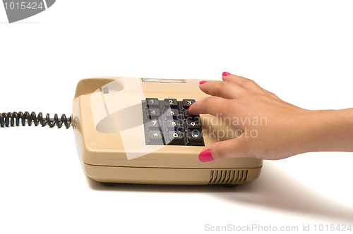 Image of Hand and telephone.