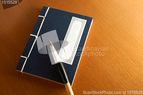 Image of chinese book and writing brush