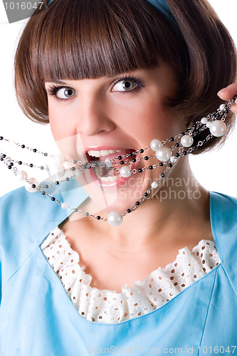 Image of woman in blue dress with pearl beads