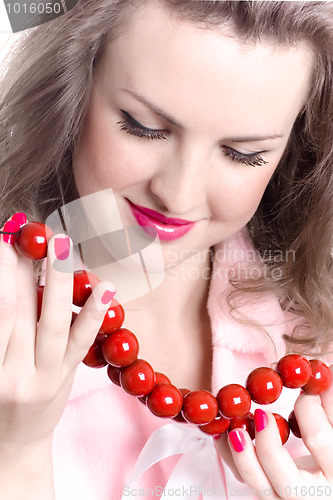 Image of woman with red beads