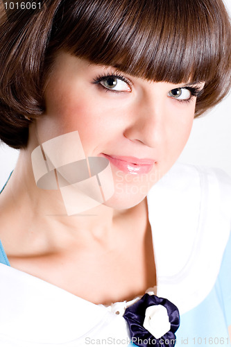 Image of brunet woman in blue dress