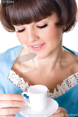 Image of woman enjoying a cup of coffee