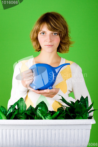 Image of girl watering flowers 