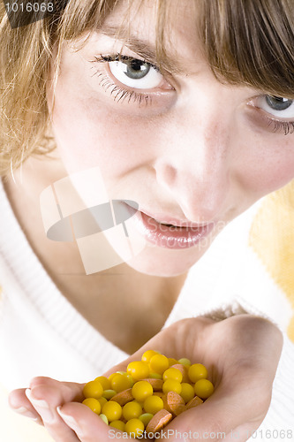 Image of woman with heap of pills