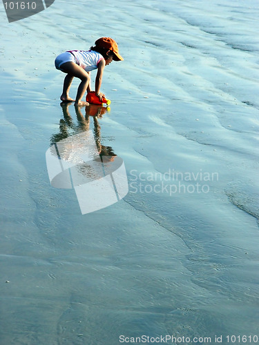 Image of Kid playing on the beach