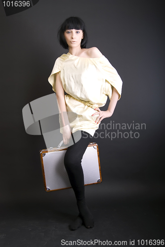 Image of A girl with suitcase  