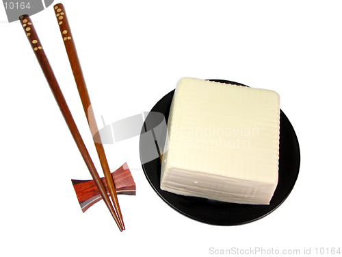 Image of Tofu and chopsticks over white