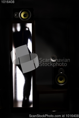 Image of A girl behind the glass door          