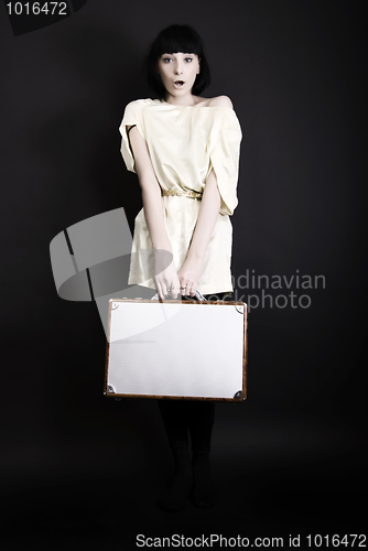 Image of A girl with suitcase  