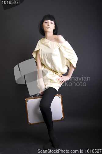 Image of A girl with suitcase  