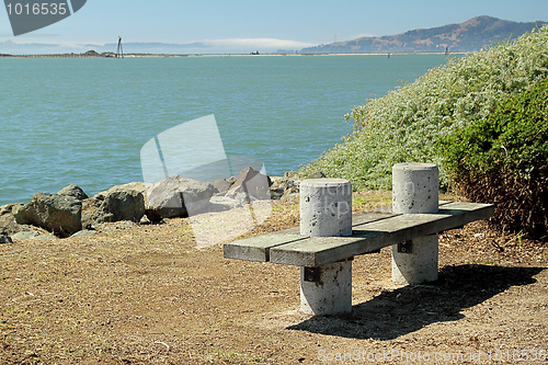 Image of A bench on the seashore