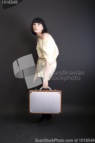 Image of A girl with suitcase  