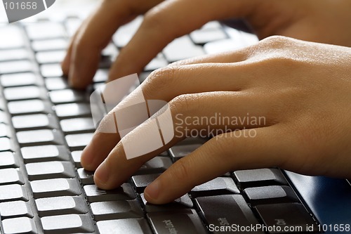 Image of Hands on laptop