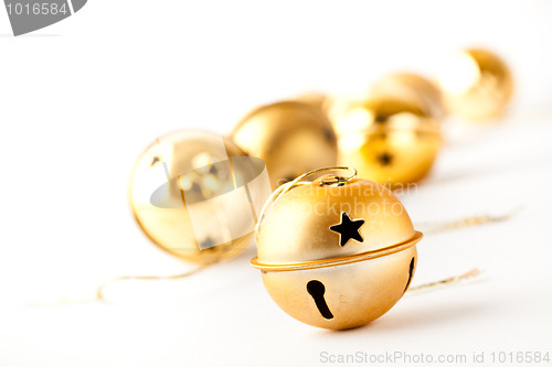 Image of Golden Christmas baubles on white