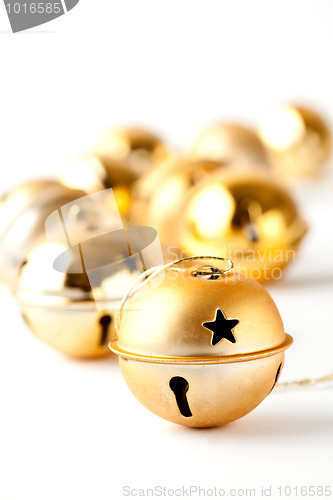 Image of Golden Christmas baubles on white