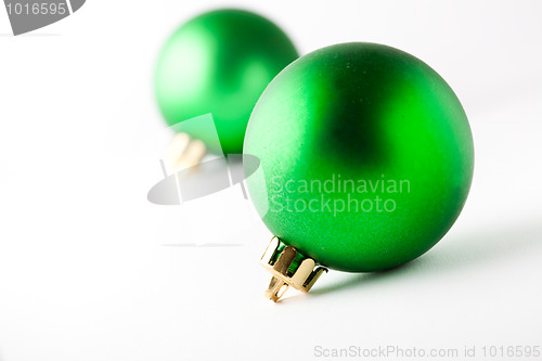 Image of Green Christmas baubles on white