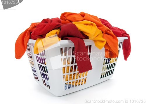 Image of Bright clothes in laundry basket. Red, orange, yellow.