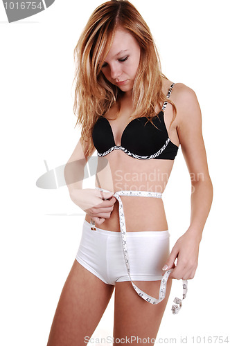 Image of Girl measuring her belly.