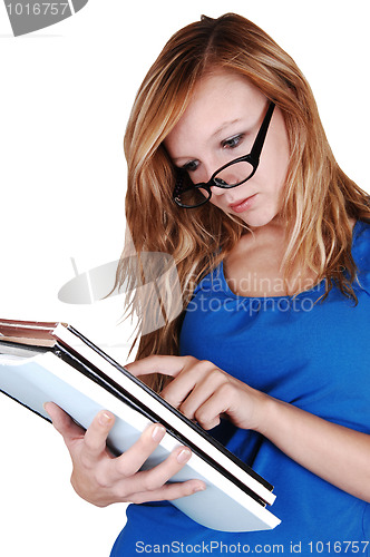 Image of Girl reading books.