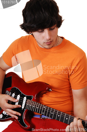 Image of Teen boy with guitar.