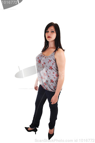 Image of Standing girl in jeans.