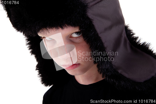 Image of cute boy with a cap, bored