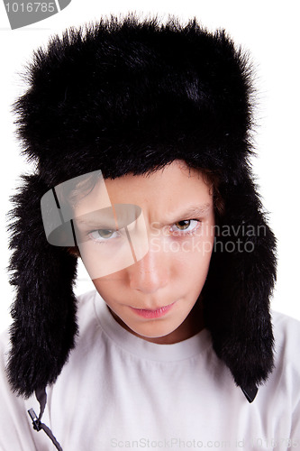 Image of cute boy with a cap, angry