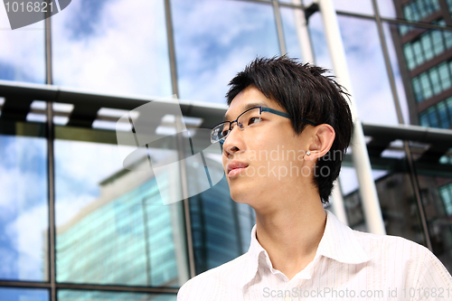 Image of asian young, handsome business man at the office building 