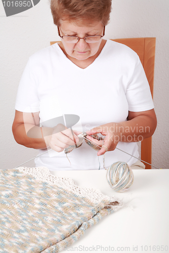 Image of Elderly woman knitting
