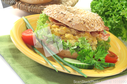 Image of Bagel with scrambled eggs and bacon