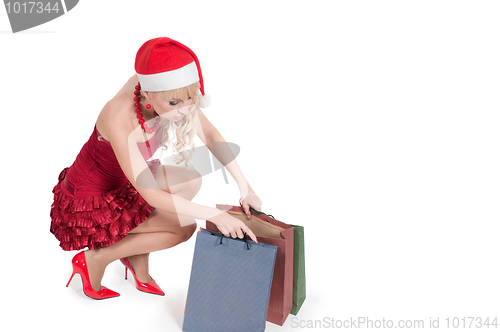 Image of Happy woman with Christmas presents