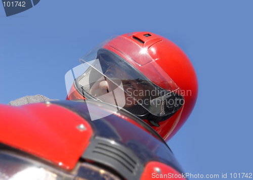 Image of Man on a red bike