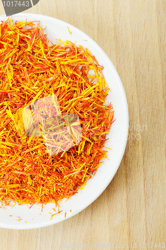 Image of Part of dish with saffron leaves spice wood