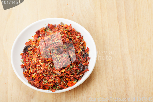 Image of Dish with spice mixture for rice courses on wood